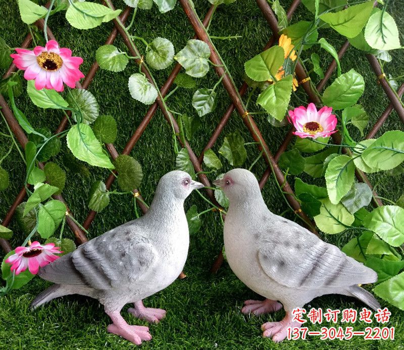 合肥雕塑小女孩一只手拿书一手和平鸽