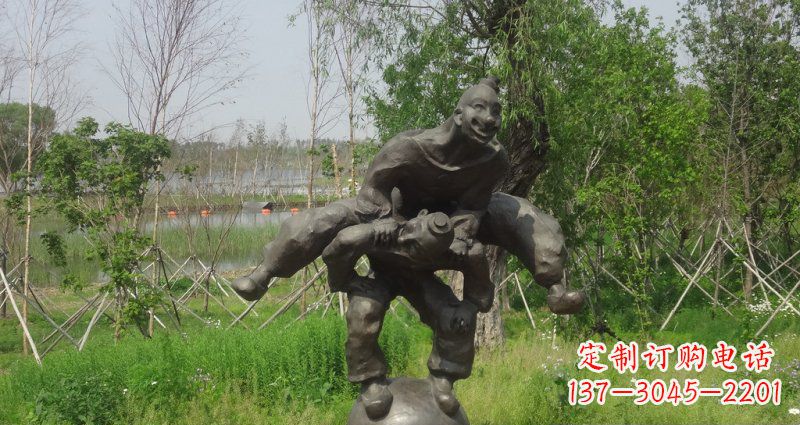 合肥园林站在球上面跳山羊的人物景观铜雕